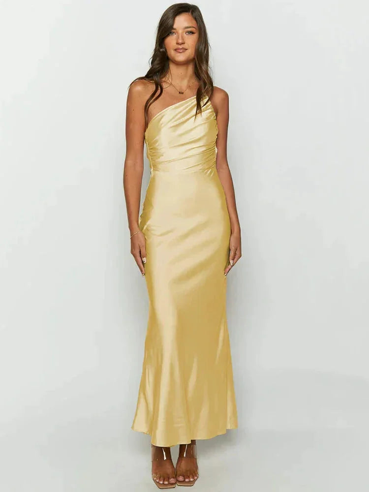 One-shoulder satin maxi dress in a bold and elegant style, perfect for special occasions or evening events.