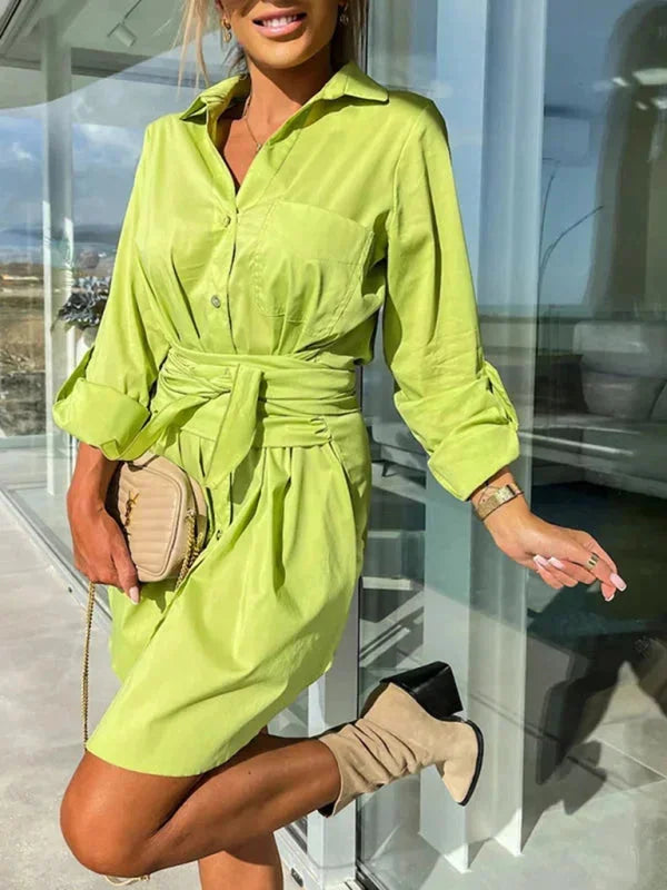 Belted shirt dress in navy blue with rolled sleeves, featuring a stylish and versatile design for everyday wear.