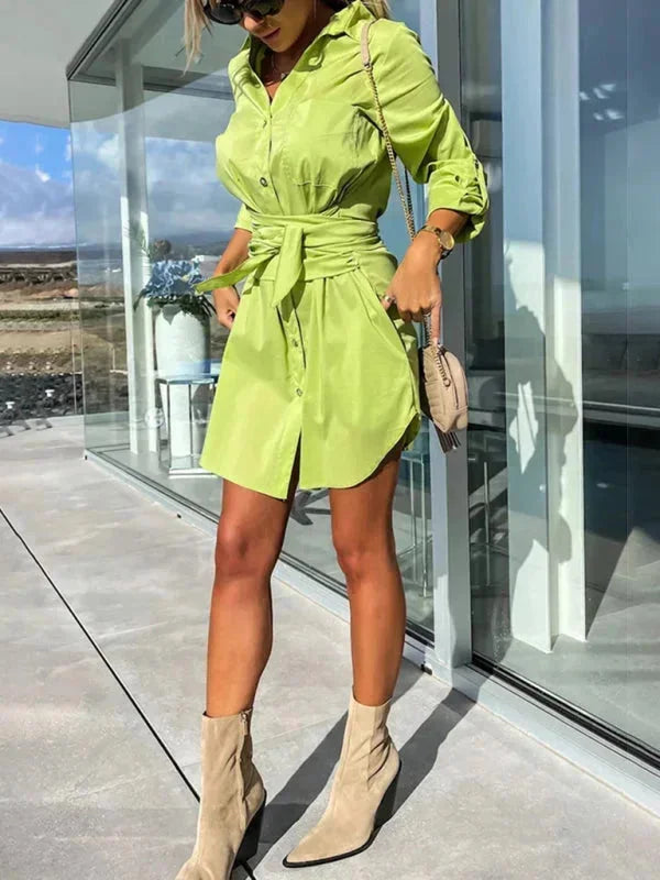 Maylin shirt dress in muted green with belt, rolled sleeves, and button-down front. Made of soft, breathable cotton blend.