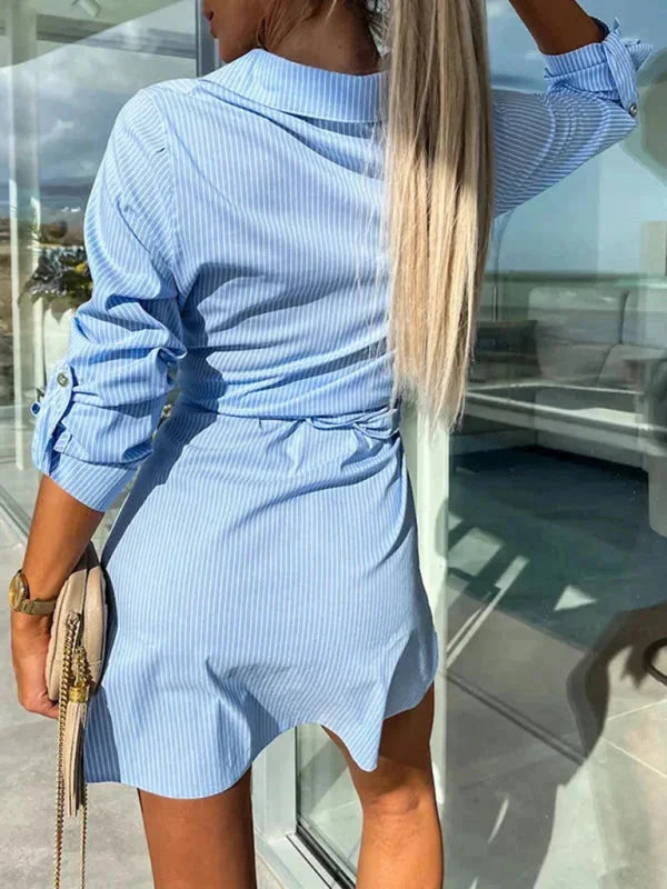 "Black belted shirt dress with rolled sleeves, versatile and stylish design"