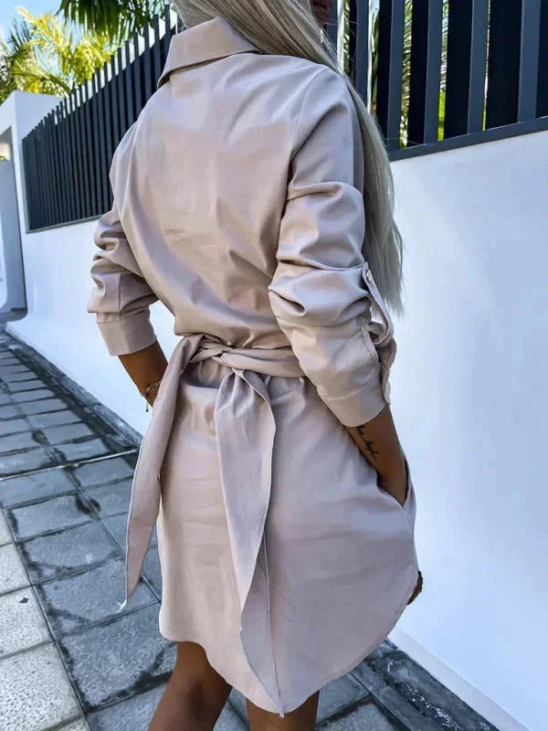 "Maylin shirt dress in black cotton with belted waist and rolled sleeves, perfect for a chic casual look."