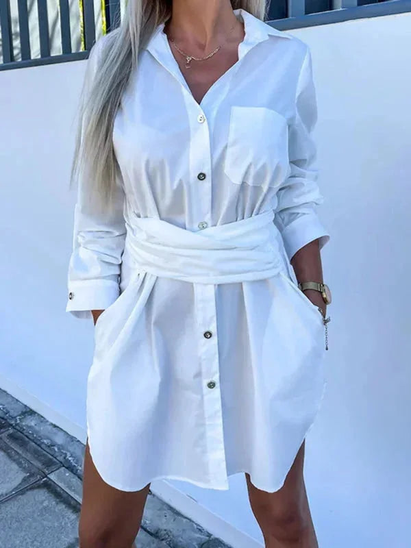 "White belted shirt dress with rolled sleeves, made of lightweight cotton blend, perfect for casual and chic everyday style."