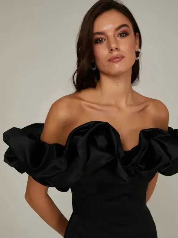 Off-shoulder dress for women with dramatic ruffles, perfect for a stylish look.