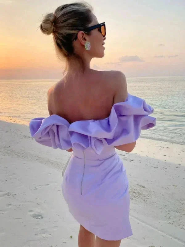Black off-shoulder dress with cascading ruffles for women, emphasizing the fitted silhouette and trendy style.
