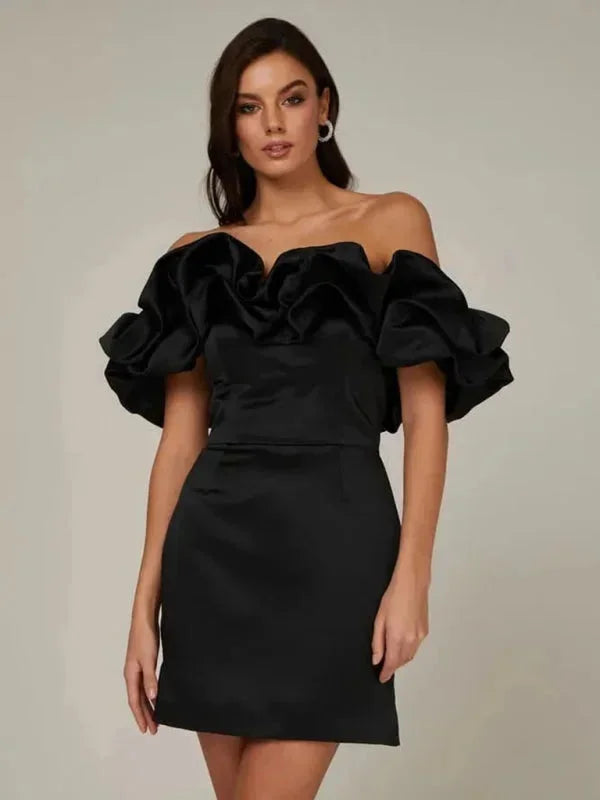 Black off-shoulder dress with ruffle design, form-fitting silhouette for women, perfect for special occasions or evening…