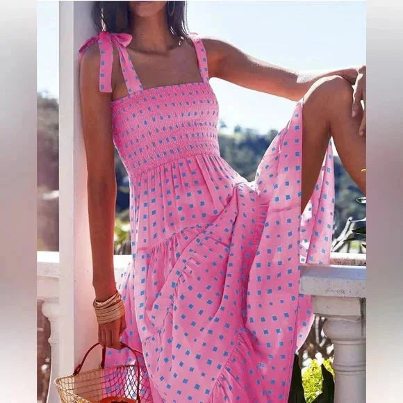 Pink patterned maxi dress with tie straps for women, featuring a soft and breathable material with a unique and stylish…