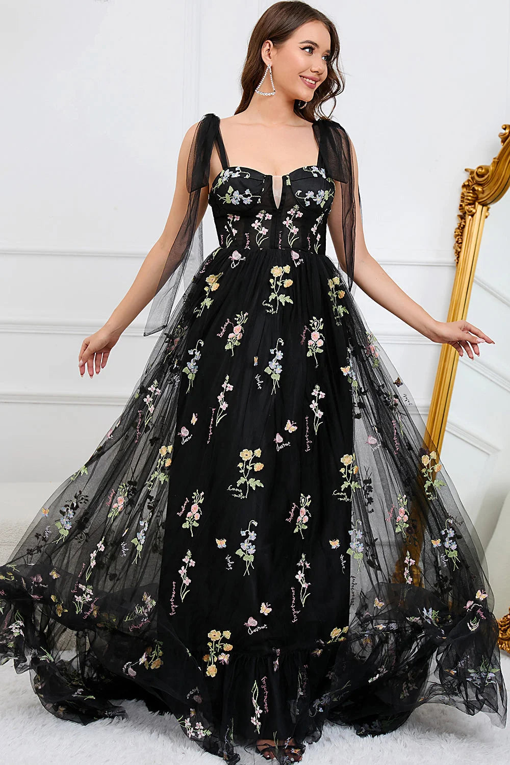 "Mitzi evening dress with delicate floral embroidery on flowy fabric, perfect for fancy occasions."