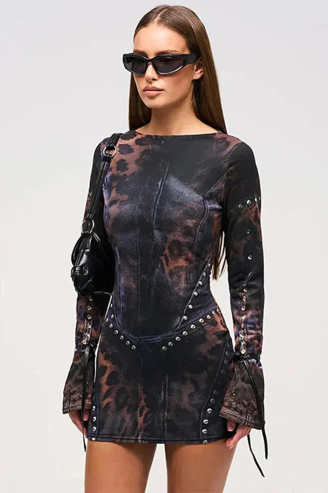 Black abstract mini dress with lace-up details for women, showcasing a modern design with unique patterns and elegant…