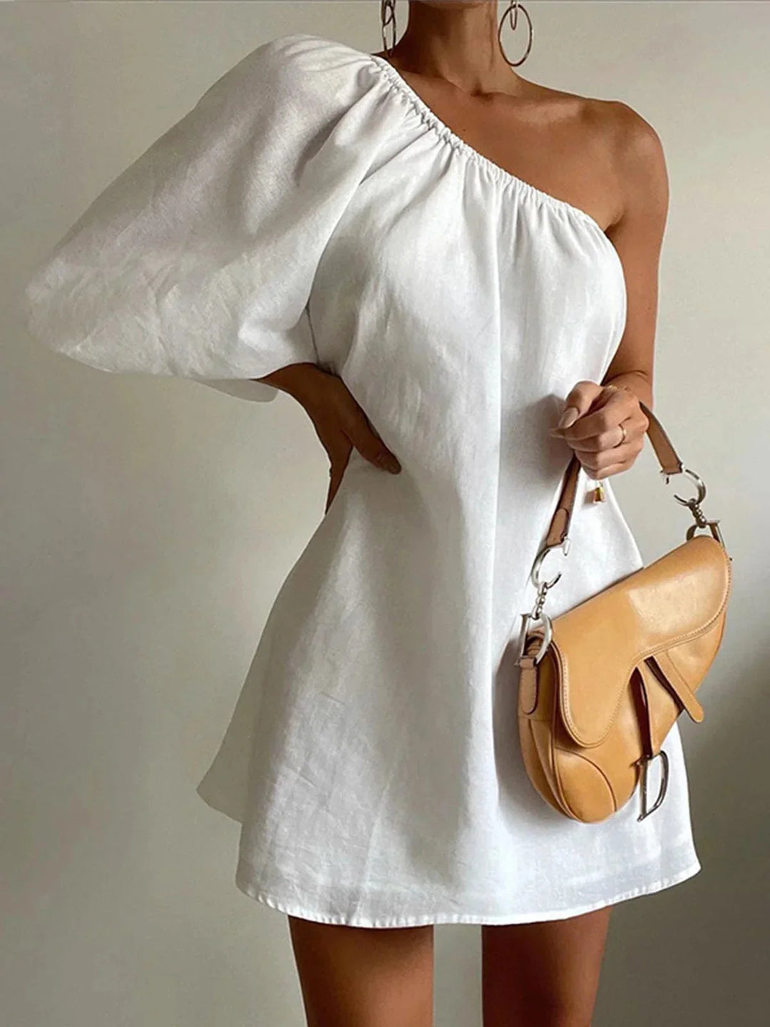 White off-shoulder dress with puff sleeves, elegant and stylish, perfect for any occasion, made of lightweight breathable…