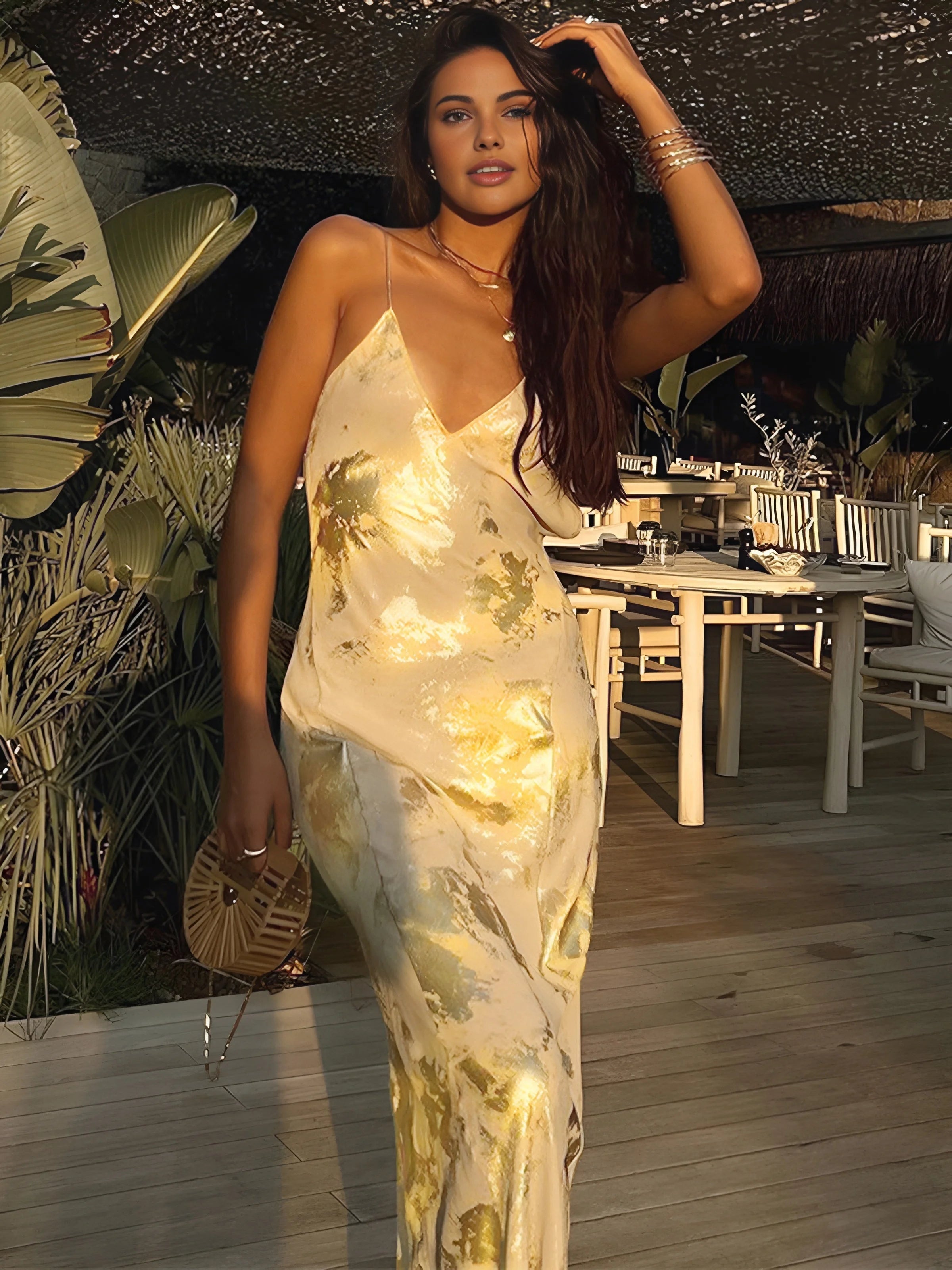 "Nashley maxi dress in gold foil detailing, featuring a sleek silhouette with intricate design elements."