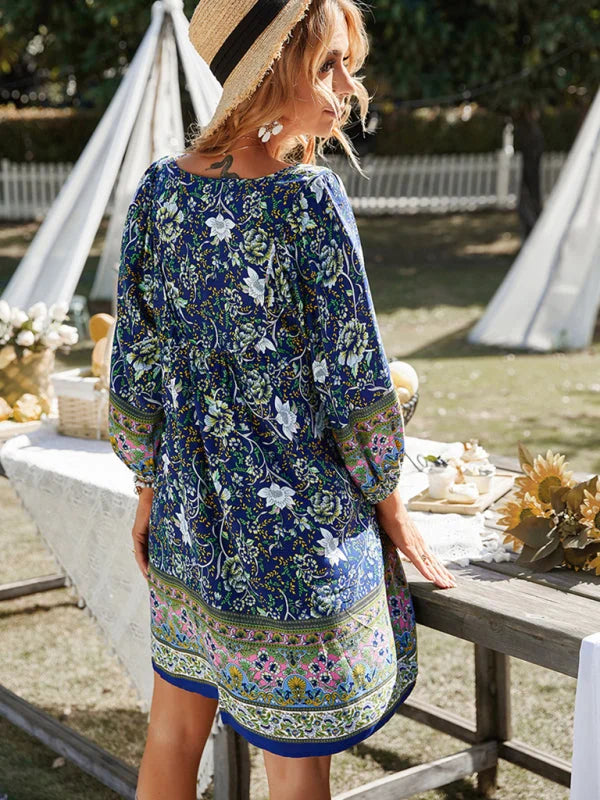 "Neveah flowy bohemian mini dress features floral patterns on lightweight fabric, perfect for a breezy summer look."