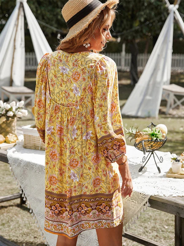 Bohemian mini dress in flowy fabric with vibrant floral patterns, perfect for casual summer days.