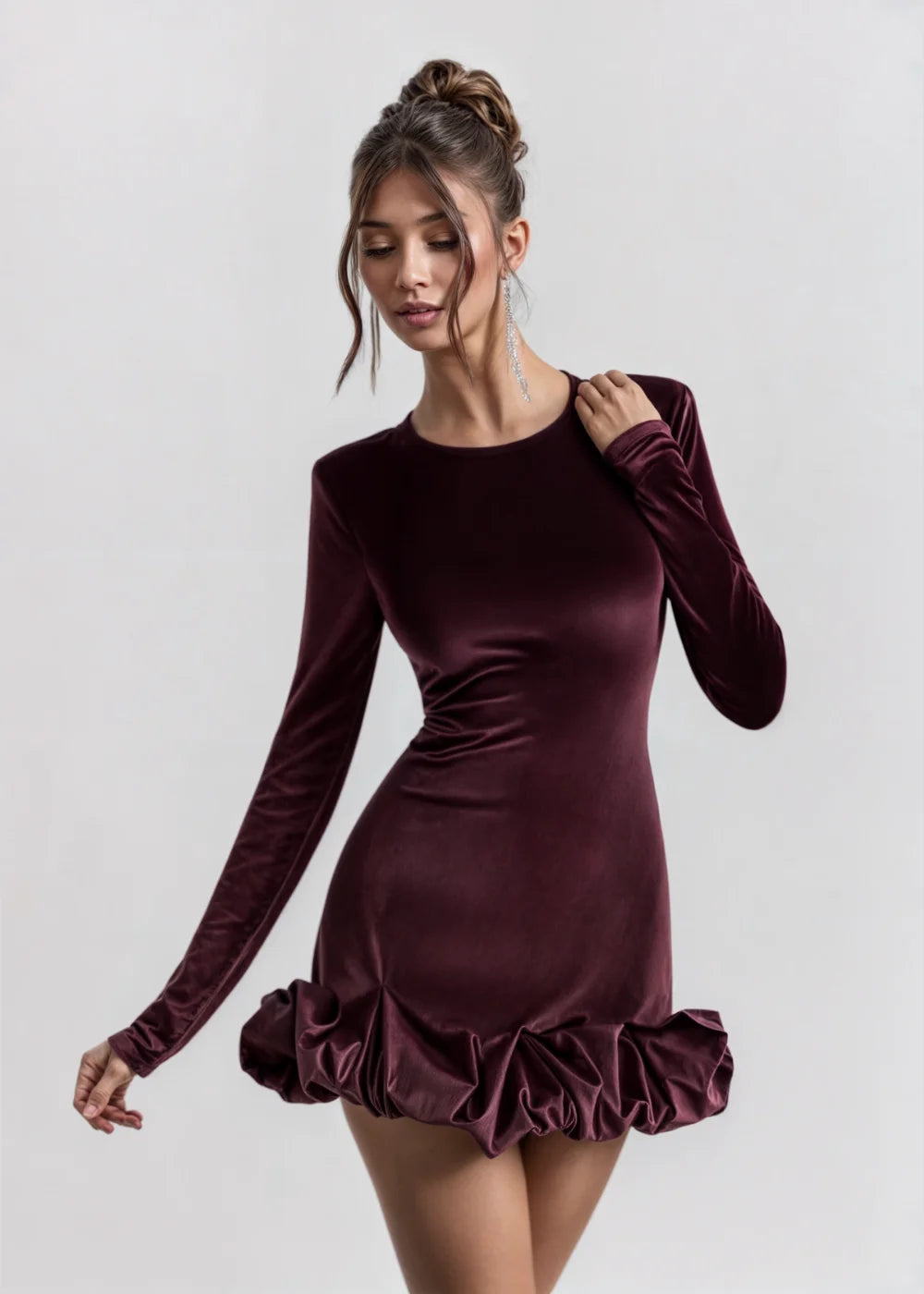 "Burgundy velvet mini dress with ruffle details, perfect for special occasions"