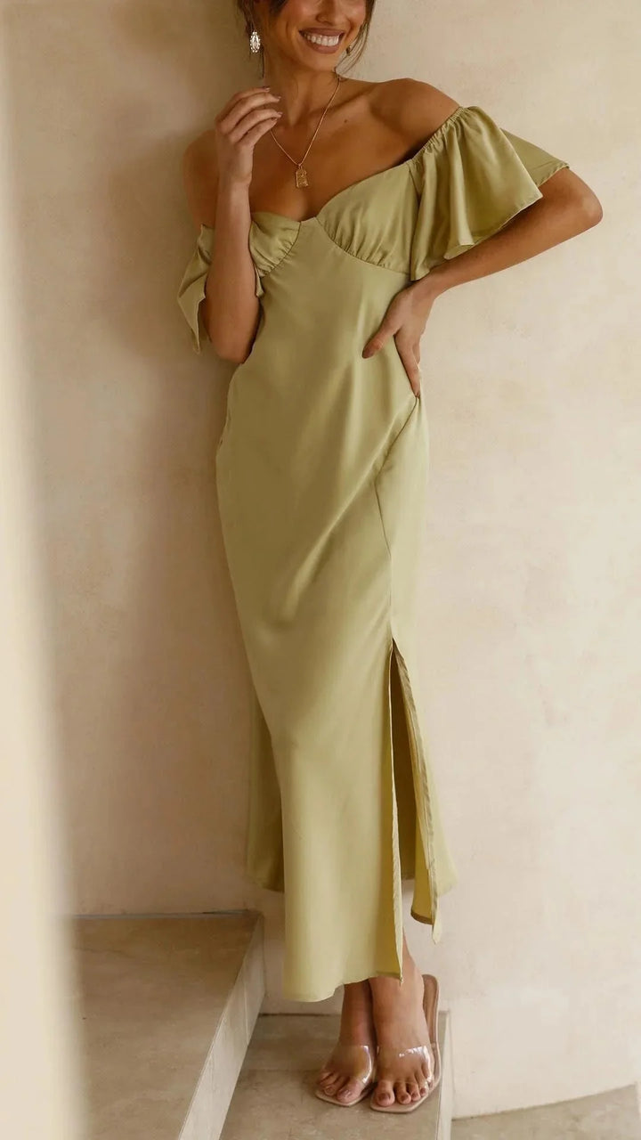 Off-shoulder maxi dress in black with elegant slits, perfect for a chic yet sophisticated look.