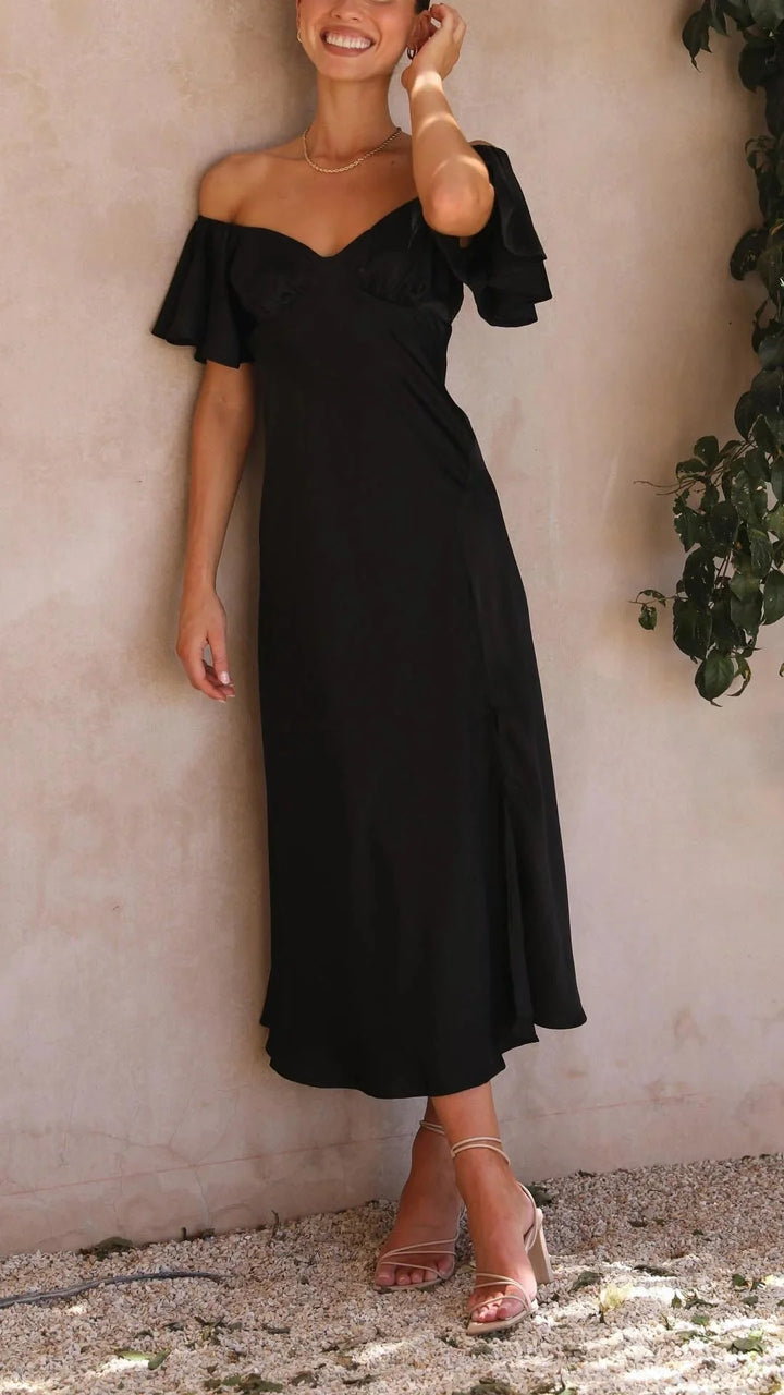 "Off-shoulder maxi dress with slits, perfect for a trendy look. Soft and flowy fabric in a chic design."