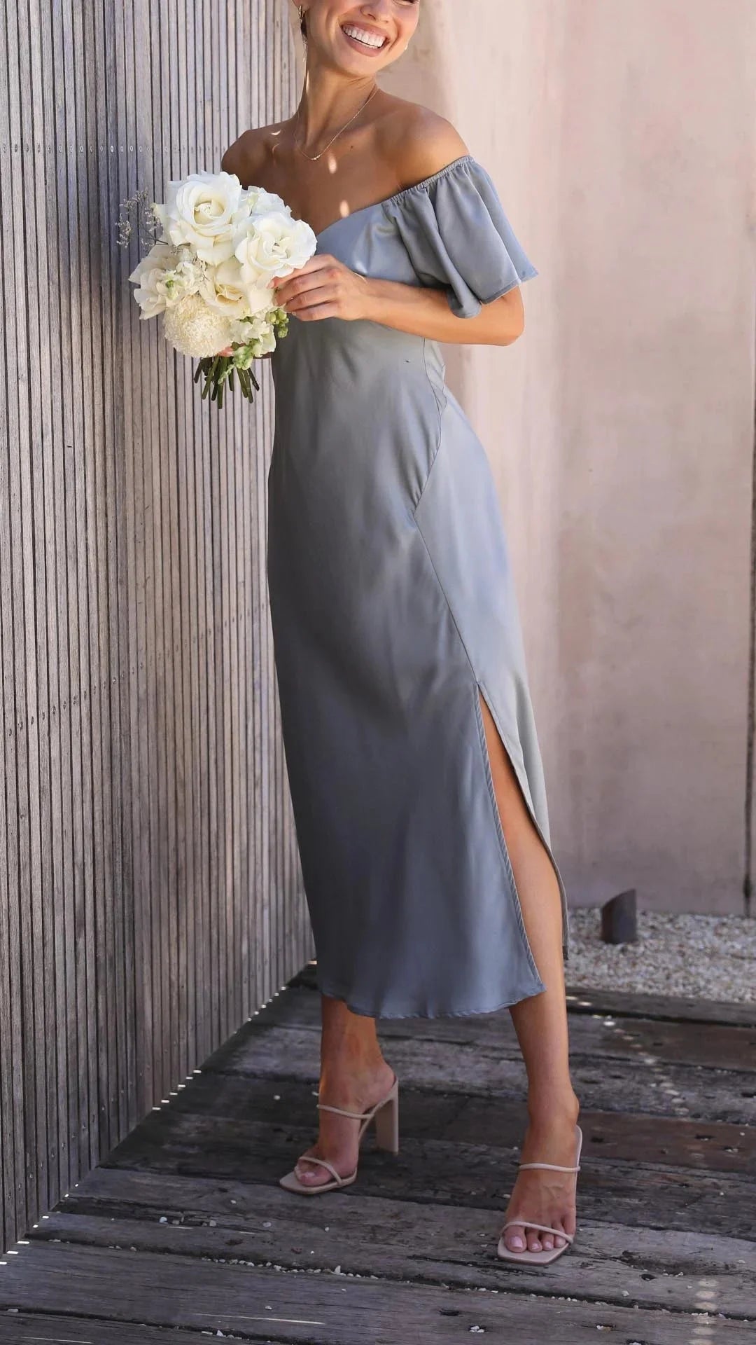 Off-shoulder maxi dress in a classy design with chic slits. Made from high-quality fabric, perfect for any special occasion.