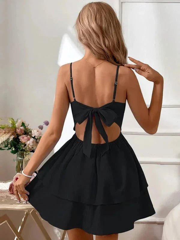 Women's flared dress with adjustable straps in soft cotton blend fabric, featuring a bold floral print and a flattering…
