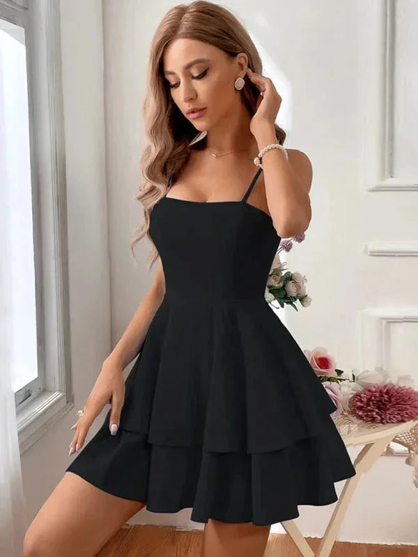 Black flared dress with adjustable straps for women. Made of soft, stretchy fabric with a flattering silhouette.
