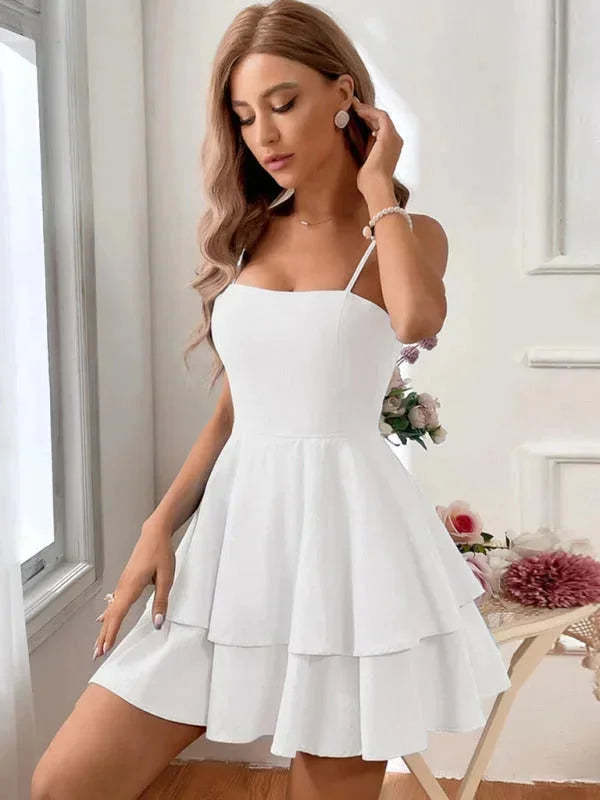 White flared dress for women made of soft and breathable fabric, with adjustable straps for a comfortable fit.