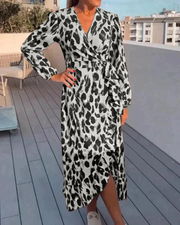 "Grey flowing wrap dress for women with slit detail, effortlessly chic in design, perfect for everyday wear or special…