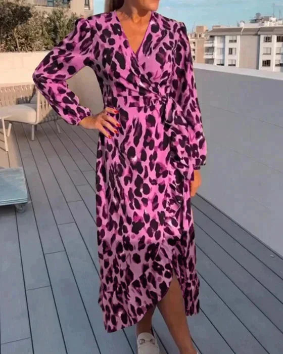 Pink flowing wrap dress for women by Phoenix, with slit. Features a stylish design, perfect for casual or formal occasions.