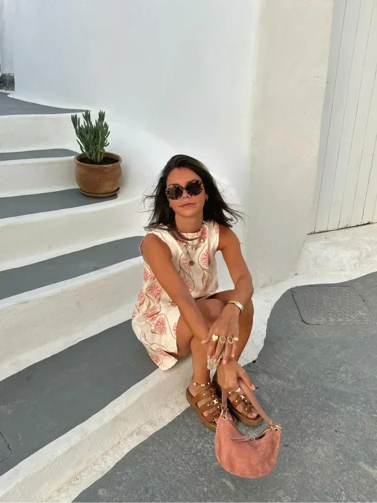 Sleeveless pink floral print dress for women, features a relaxed fit and breathable fabric perfect for summer outings.