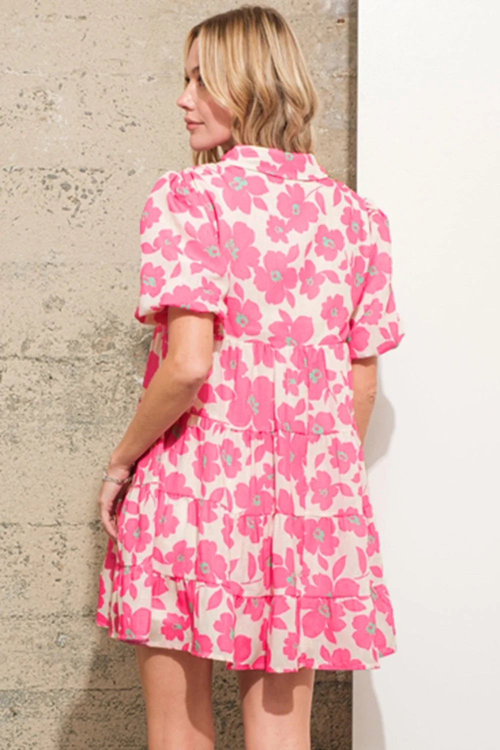 Pink tiered shirt dress with floral print, featuring a lightweight fabric ideal for casual outings and sunny days.