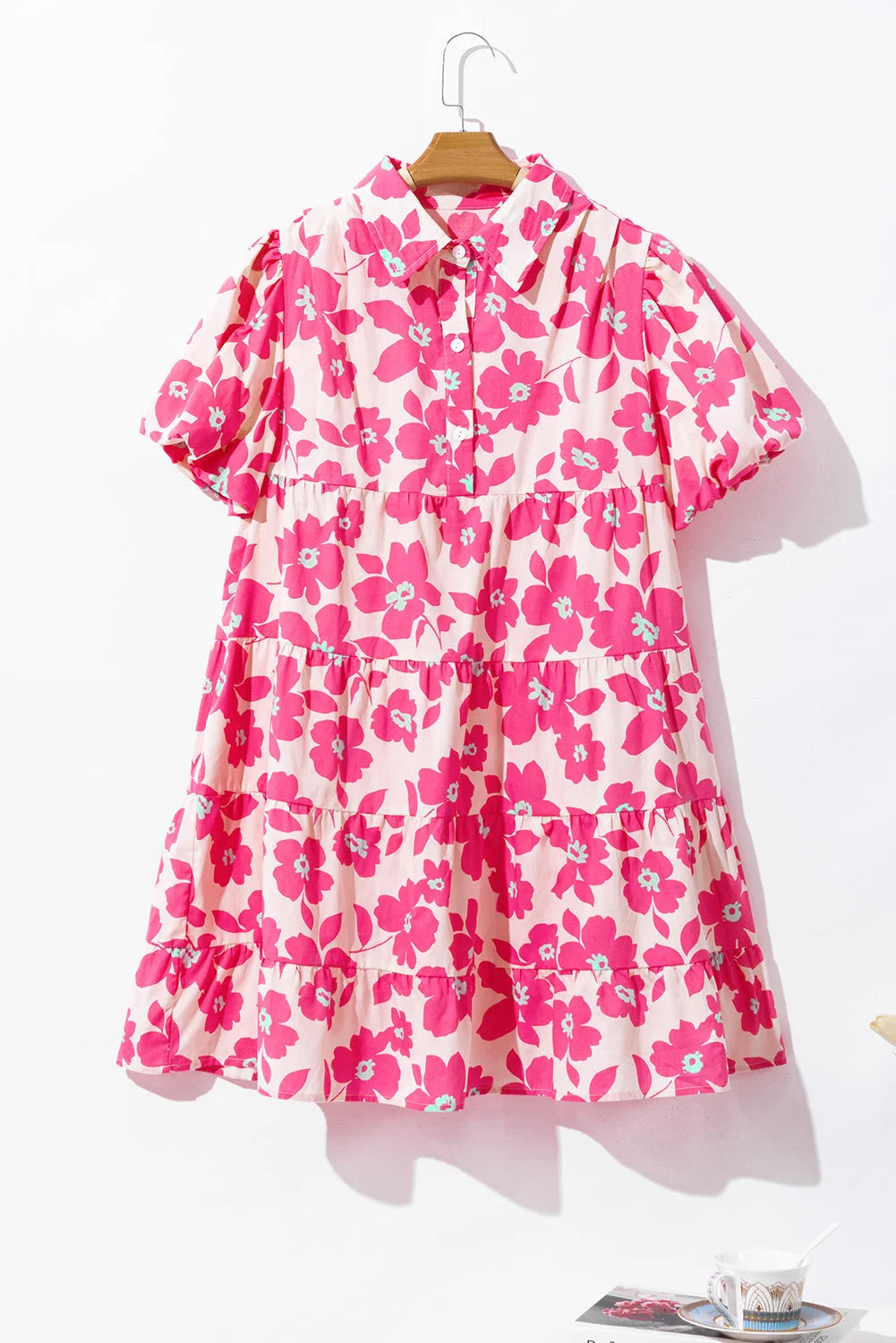 Pink tiered shirt dress with floral print in lightweight cotton blend, perfect for a casual summer day out.