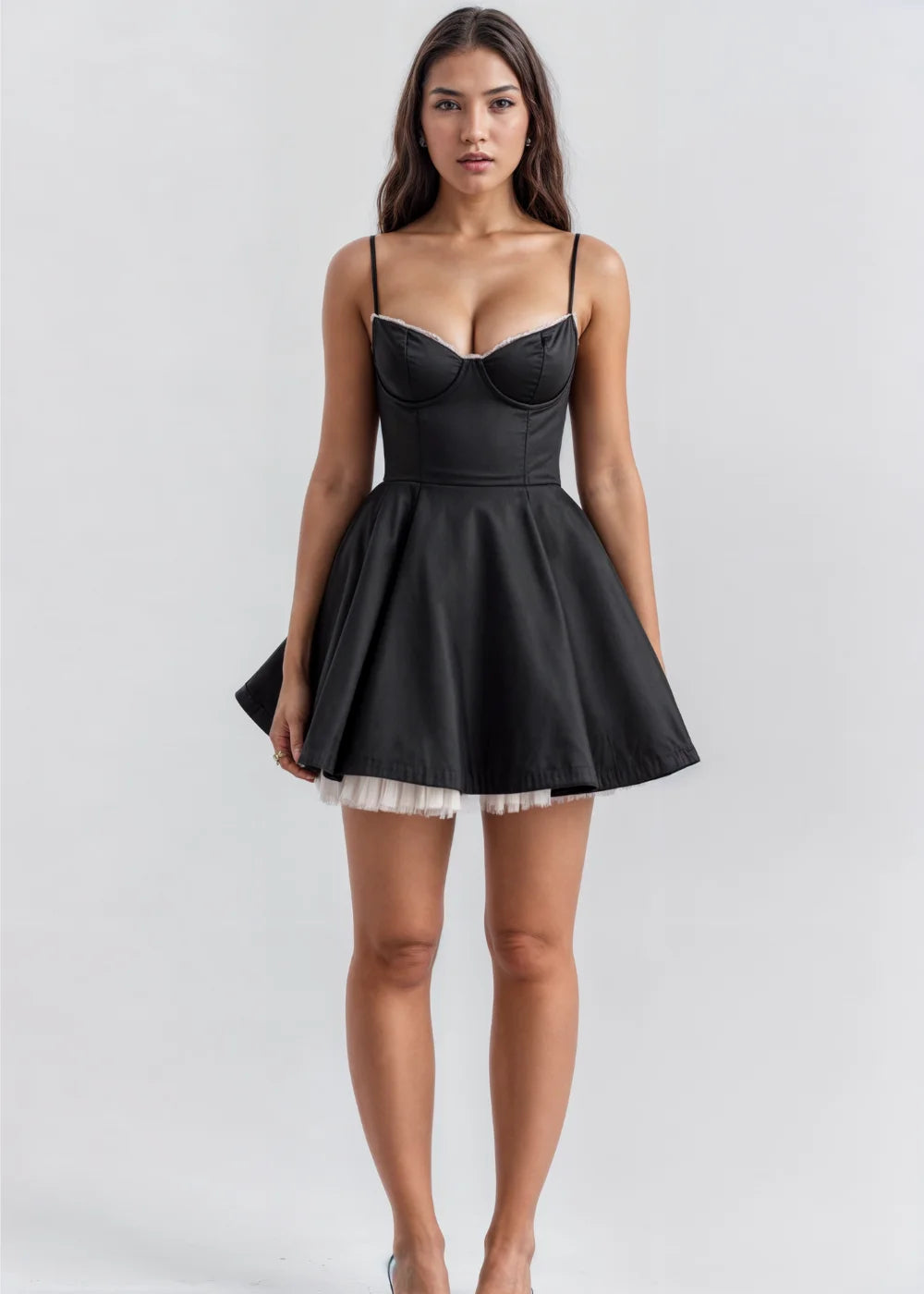 Black spaghetti strap flare dress with a textured knit fabric, featuring a fitted bodice and flowy skirt. Perfect for a…