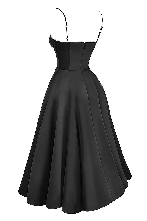 Black satin dress with cream tulle hem, a touch of elegance and contrast in an evening wear outfit perfect for special…