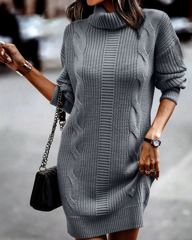 "Gray turtleneck knit dress featuring a stylish design, perfect for cold weather. Made of soft and warm fabric."