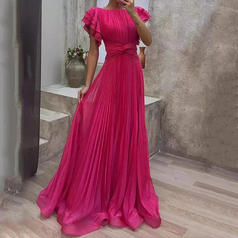 Women's pleated maxi dress with ruffled sleeves in soft, flowing fabric. Elegant design perfect for any occasion.