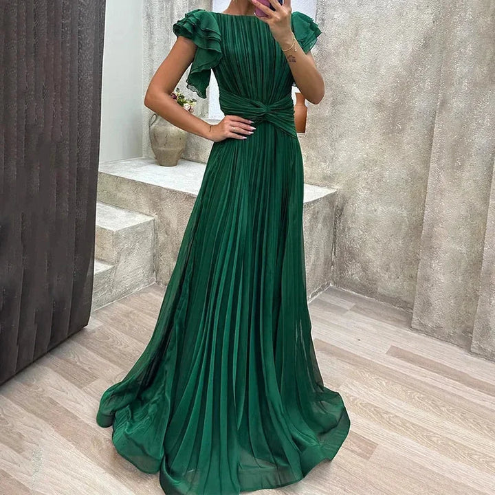 Green pleated maxi dress with ruffled sleeves for women. Soft and flowy fabric with a flattering silhouette perfect for any…