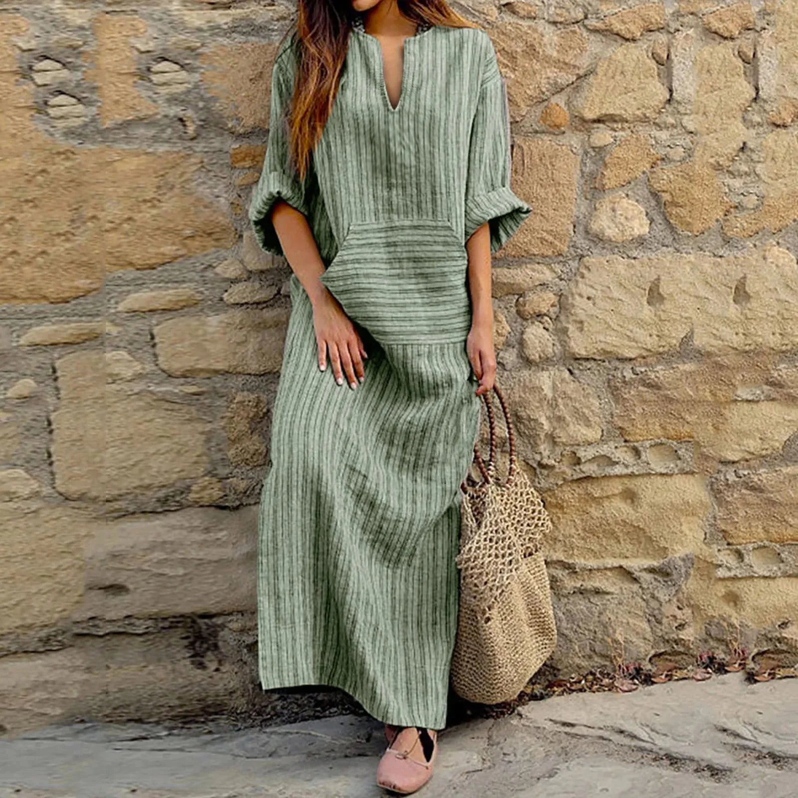 Green striped long-sleeve maxi dress made of soft organic cotton fabric with a flattering silhouette.