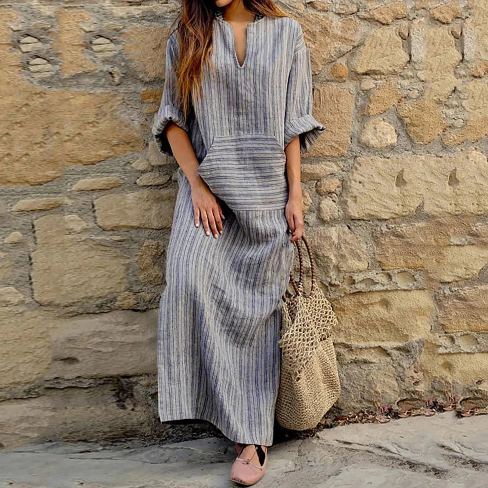 Grey striped long-sleeve maxi dress with a relaxed fit, perfect for casual wear. crafted from soft and comfortable fabric.