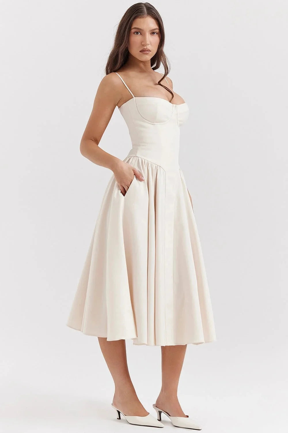 Beige fitted bodice dress with flare for women, showcasing a sleek design & structured silhouette, perfect for special…