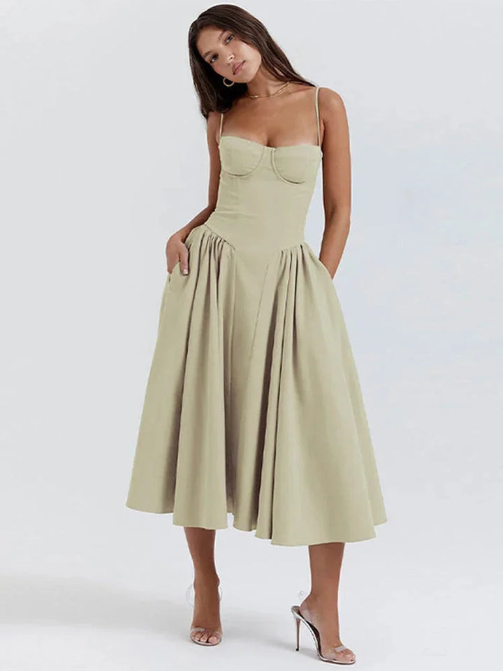 Green fitted bodice dress with flare for women, featuring a soft cotton blend fabric and a stylish design perfect for casual…