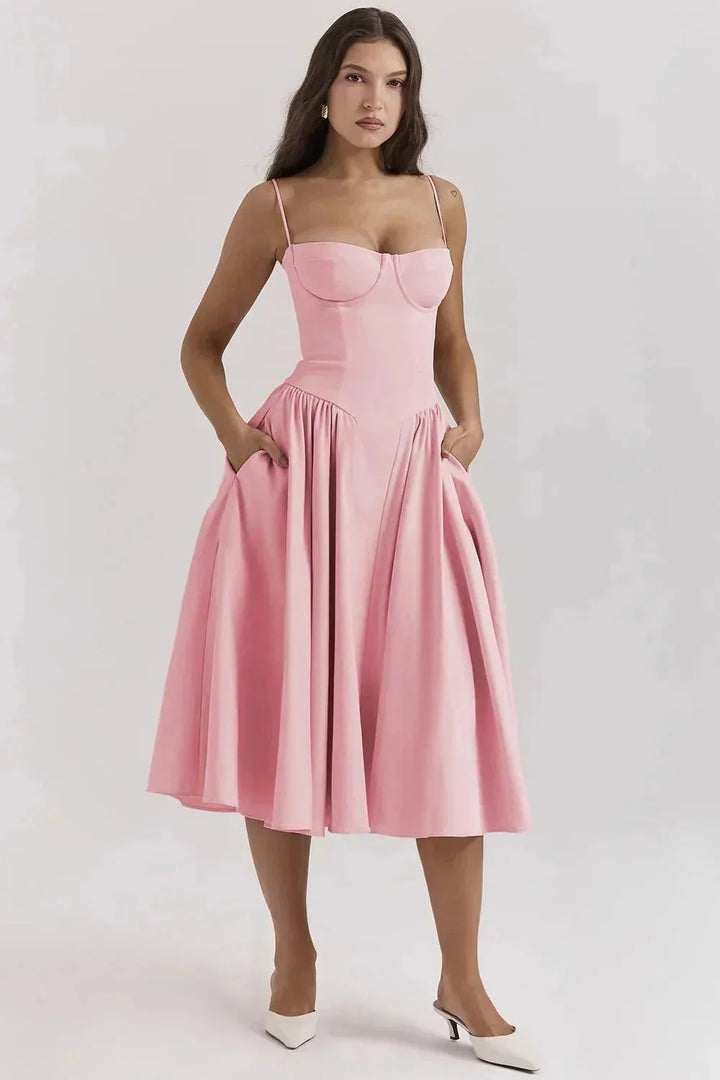 Pink fitted bodice dress with flare for women, made from high-quality cotton blend with a modern twist, perfect for any…