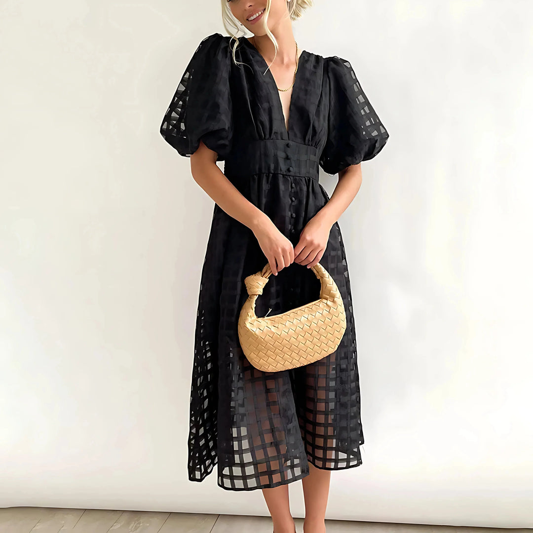 Black puff-sleeve midi dress with texture, perfect for everyday wear.