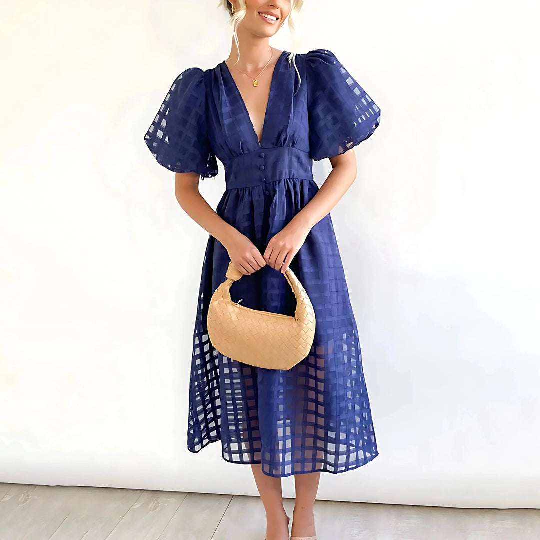"Navy blue puff-sleeve midi dress with textured fabric for women, elegant design ideal for casual or formal occasions."