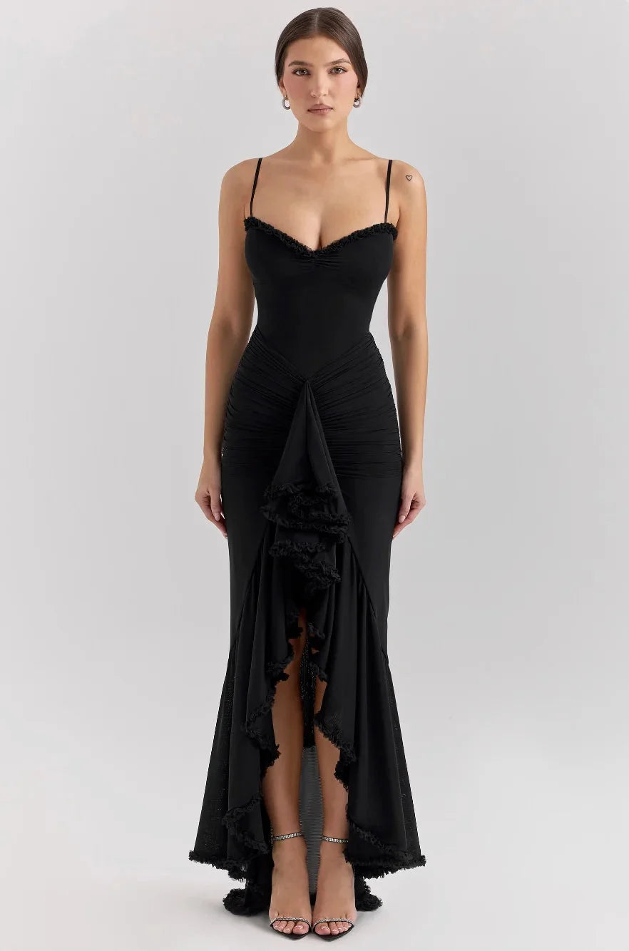Black asymmetrical midi dress with ruffled detail, perfect for a chic and feminine look. Made from a soft and flowy material.