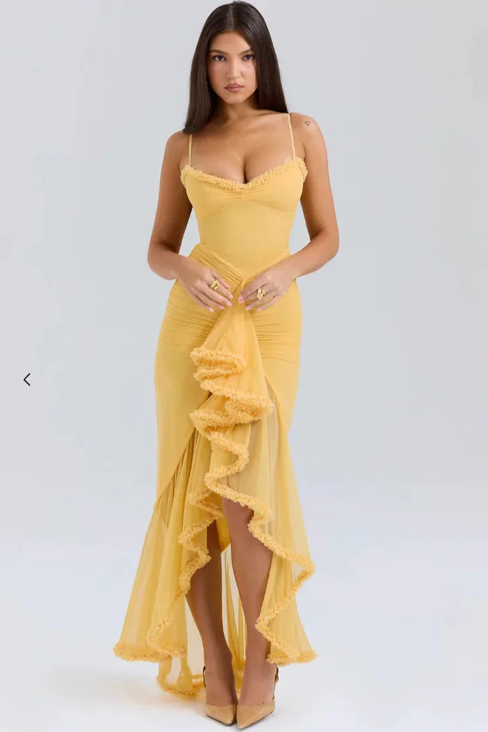 Yellow Sakura women's ruffled asymmetrical midi dress made of lightweight chiffon with a playful floral print and a stylish…