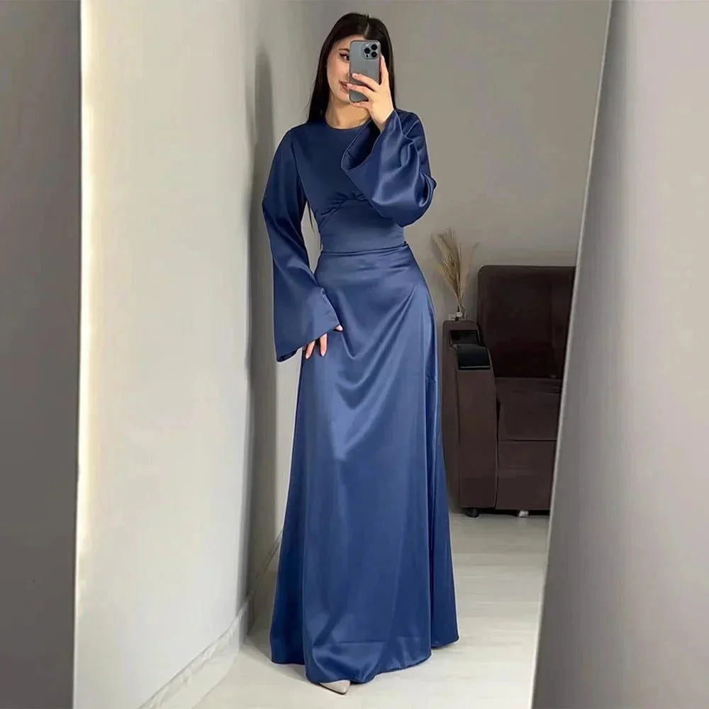 Blue full-length dress for women, featuring elegant sleeves and a tasteful design. Crafted from high-quality fabric.
