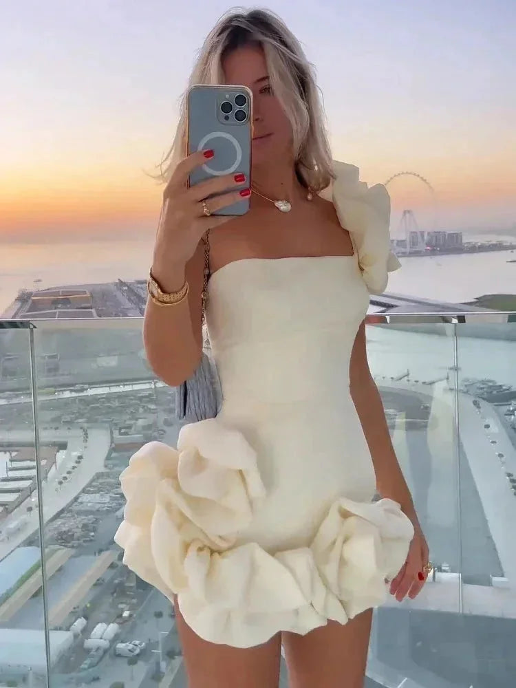 Strapless white dress with bold ruffles for women, perfect for summer.