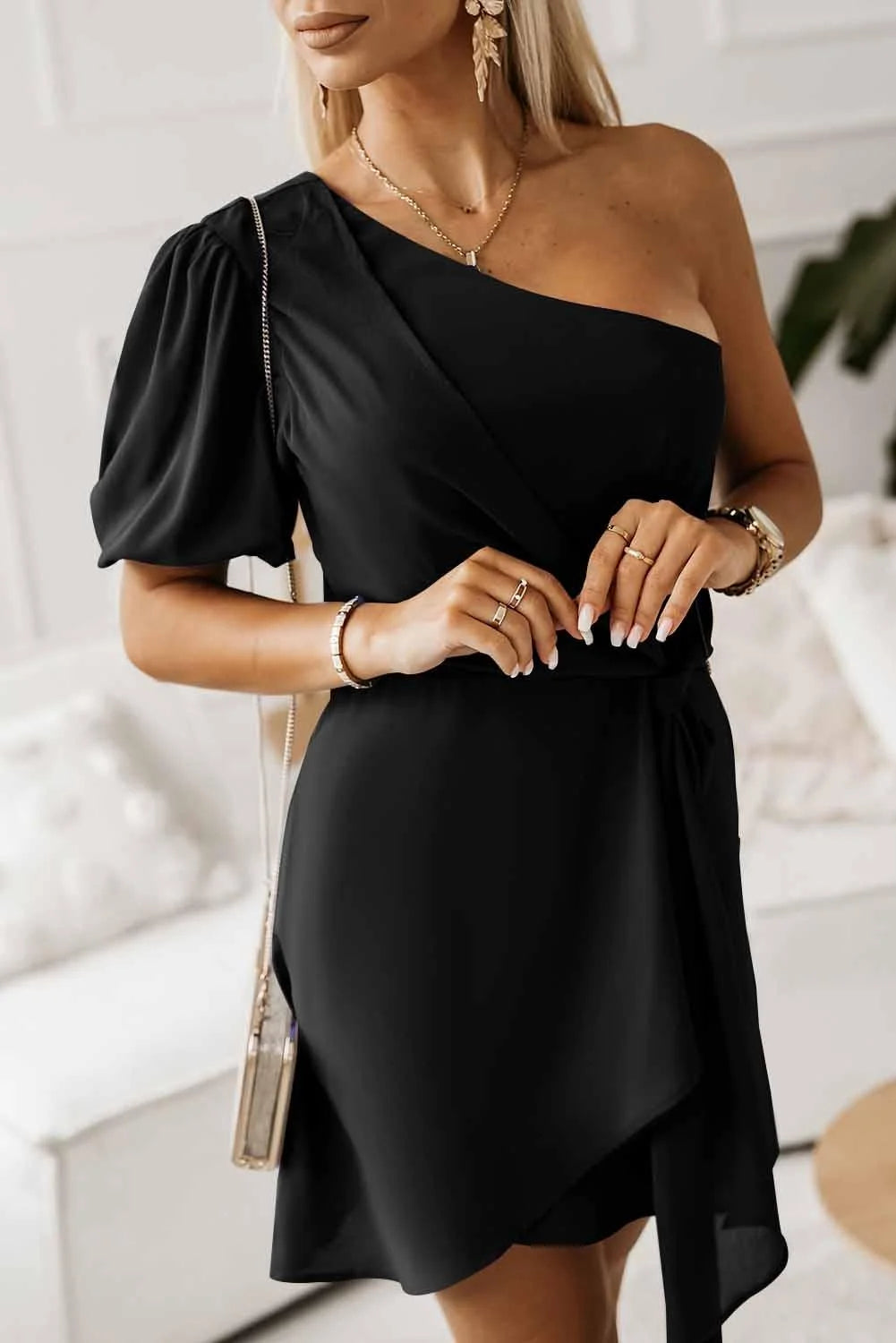 Black one-shoulder twist knot dress by Samiya, showcasing elegant design with a stylish twist detail.