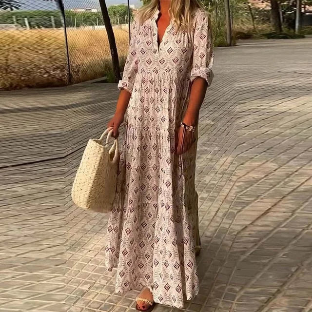 Flowy v-neck summer dress in a soft, breezy fabric with a relaxed fit, perfect for warm days and casual occasions.