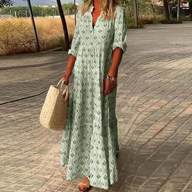 "Green flowy v-neck summer dress by Saray, made from lightweight fabric with elegant draping and a comfortable fit"