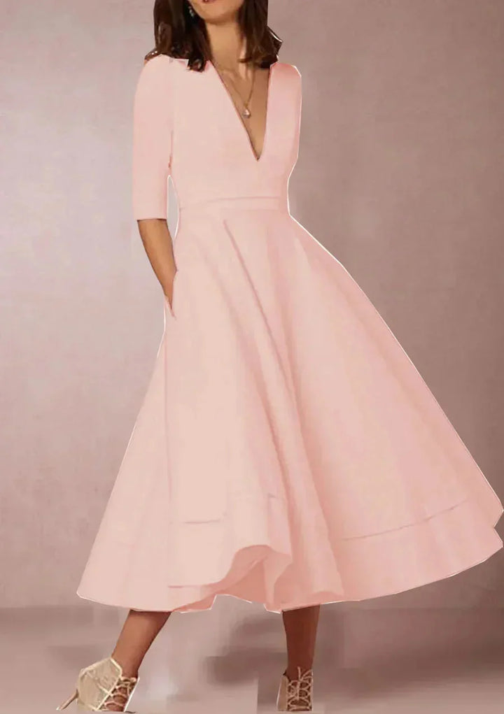 Pink midi dress with deep V-neck and flared skirt for women, perfect for a stylish and feminine look.