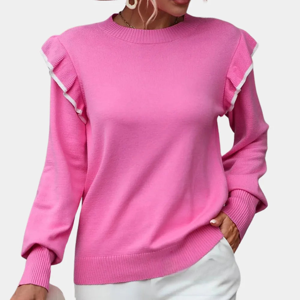 Pink ruffle sweater with a contemporary design, perfect for a feminine style.