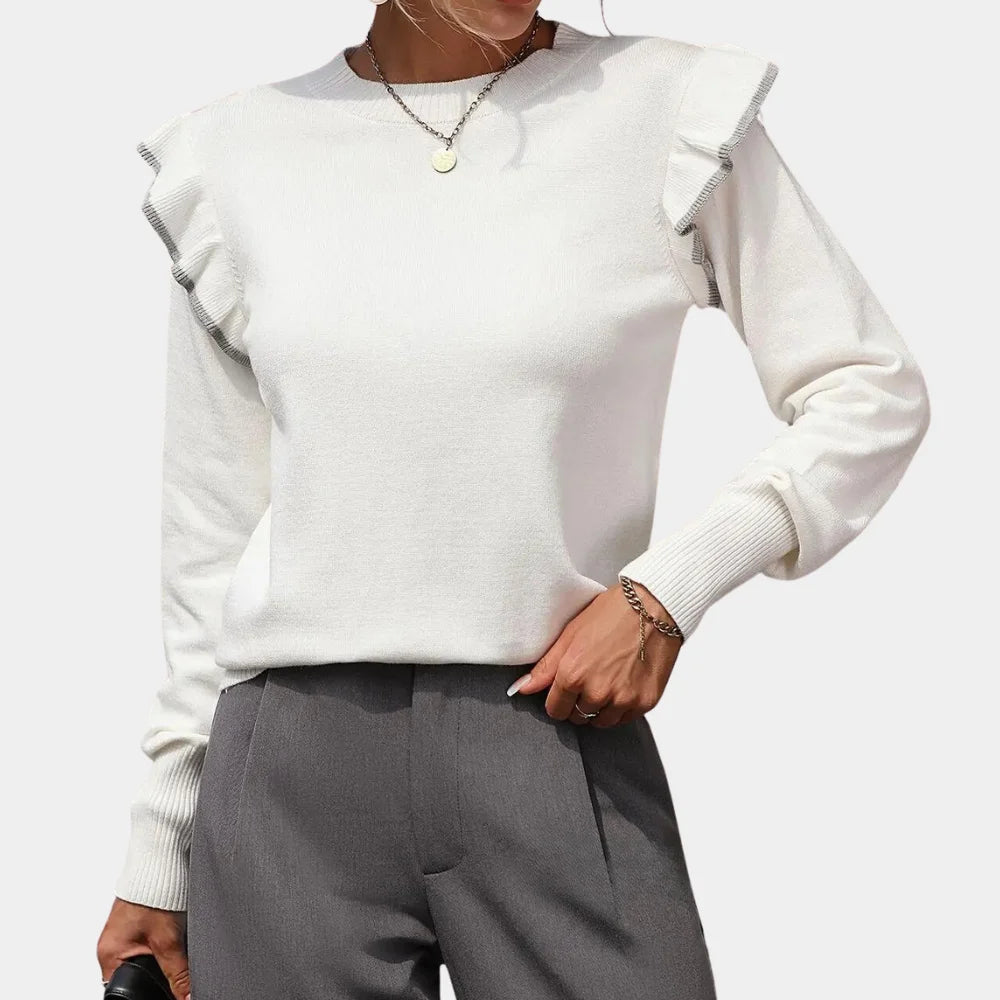 White ruffle sweater with a contemporary design, perfect for a feminine look.